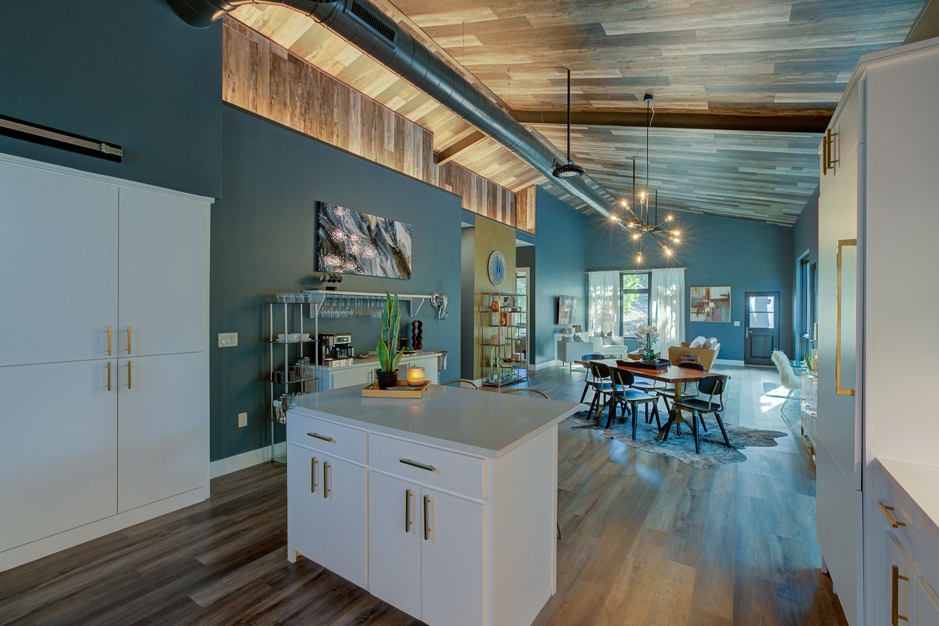 A kitchen with a large island in the middle of the room.