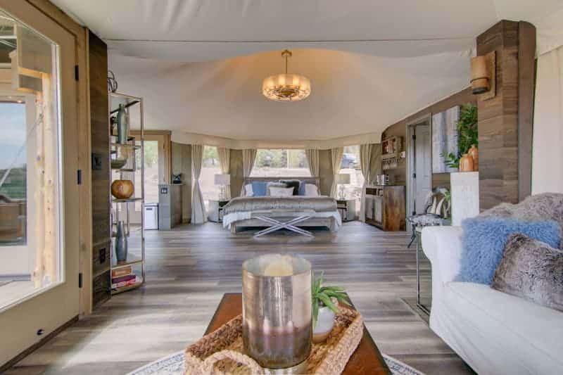 A living room filled with furniture and a large bed.