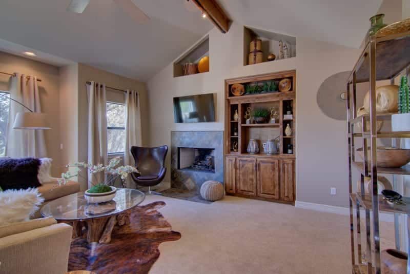 A living room filled with furniture and a fireplace.