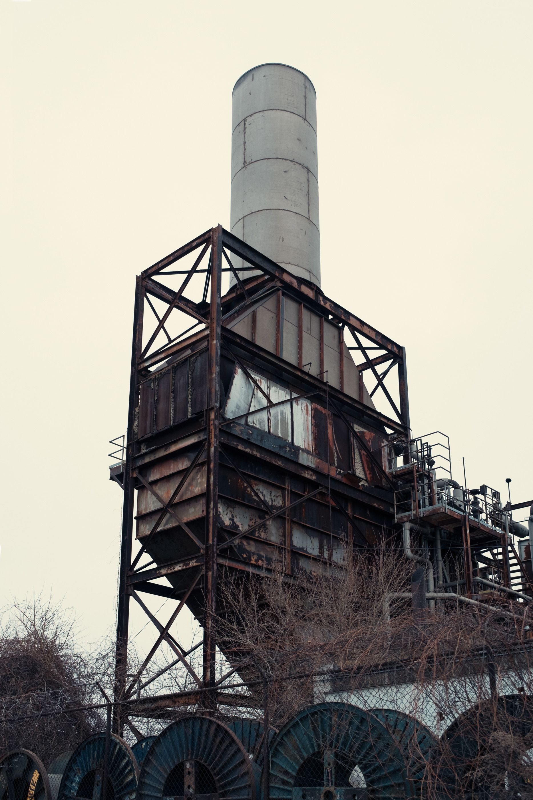 An industrial chimney on an overcast day.