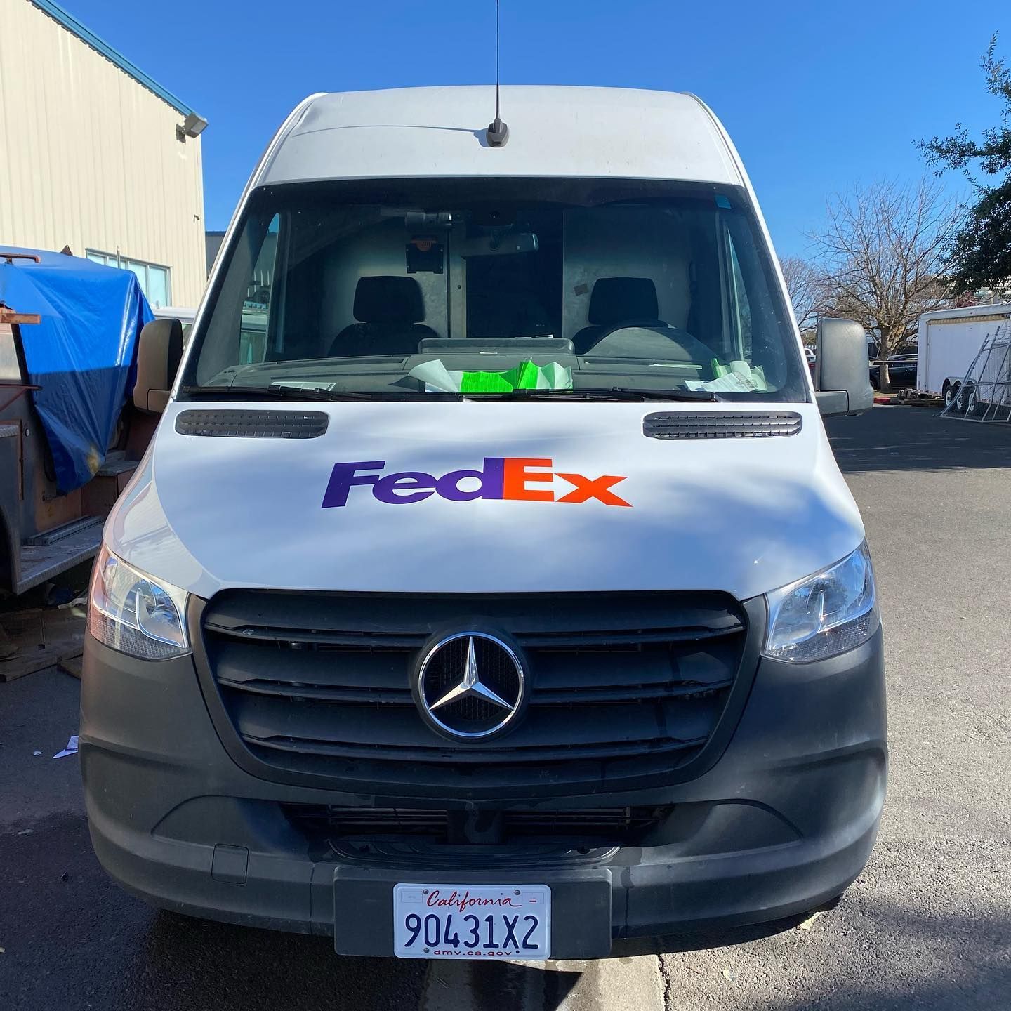 A fedex van is parked in a parking lot