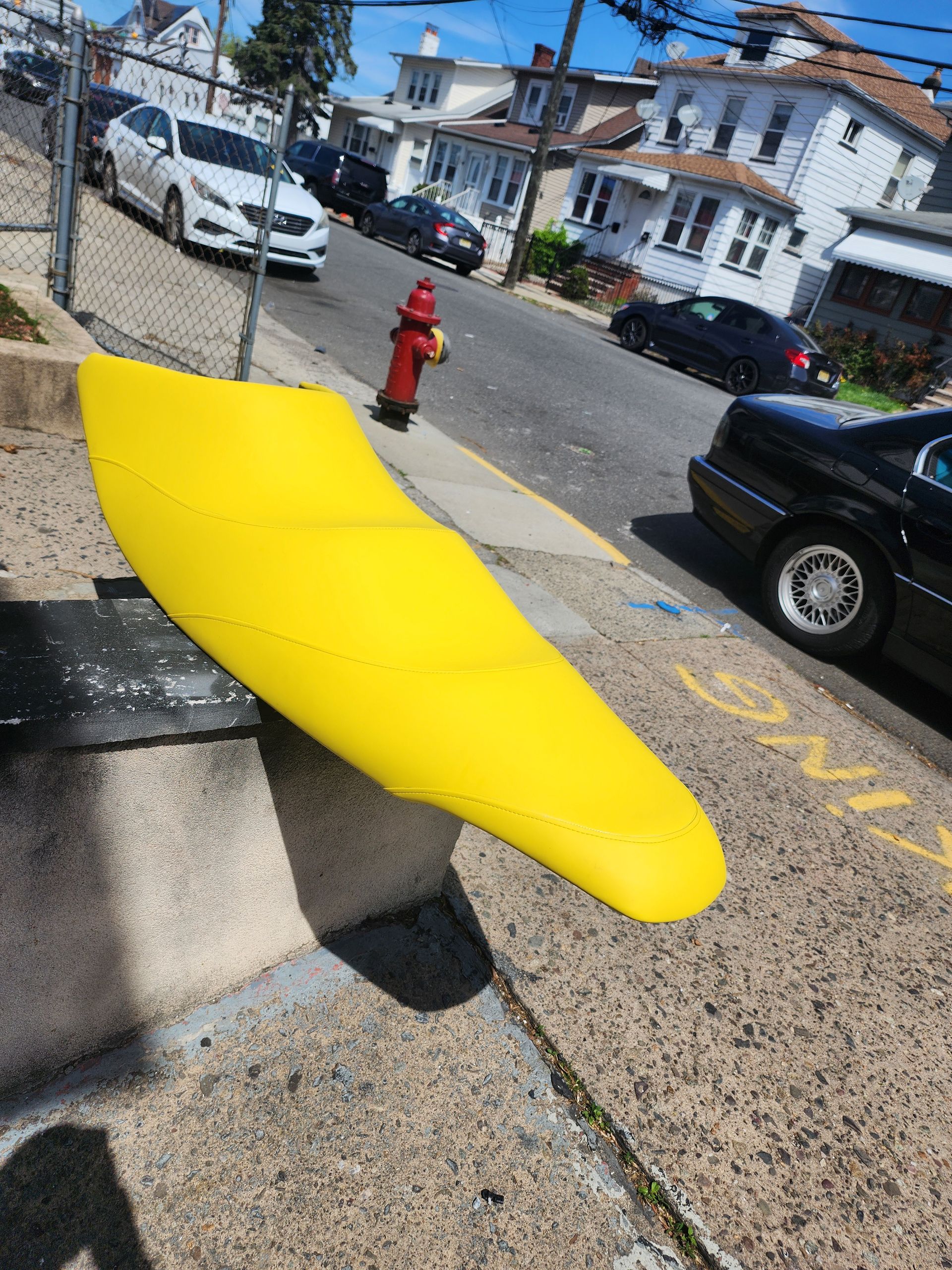 A black car with red stripes on the seats
