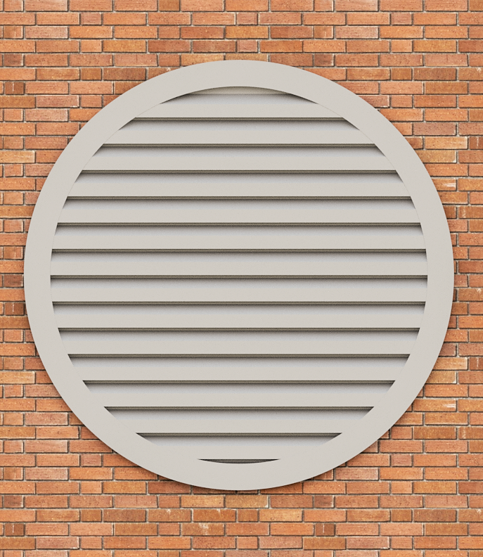 Une grille de ventilation ronde est accrochée à un mur de briques.