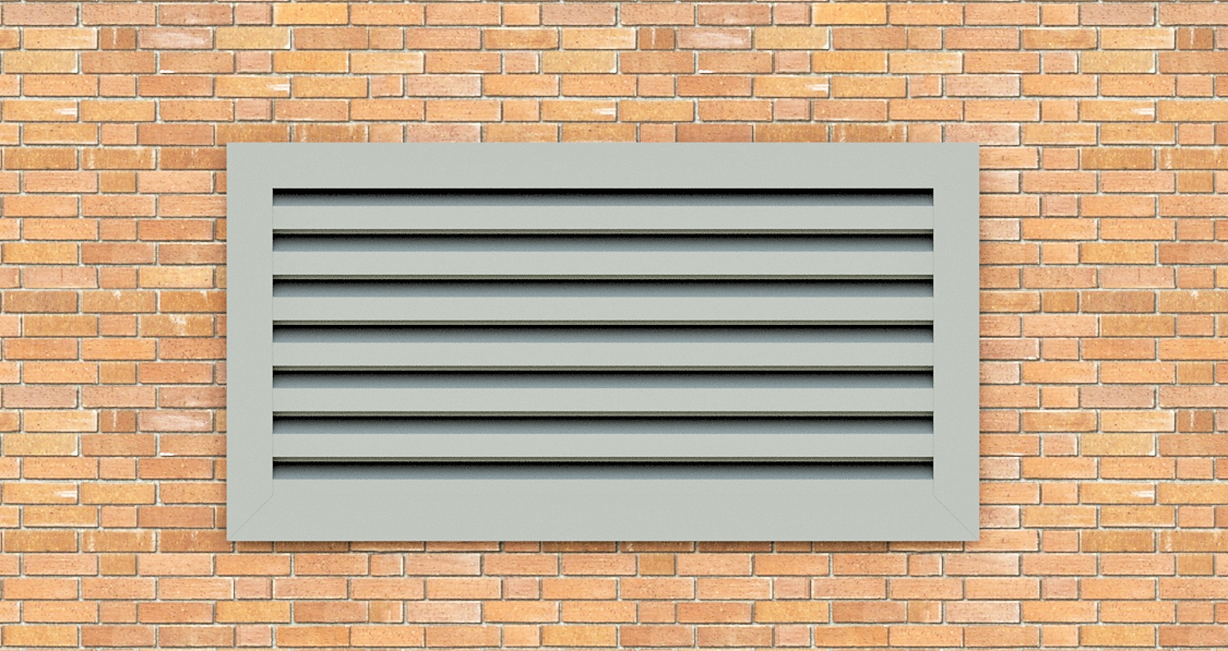 Un mur de briques avec une grille métallique dessus.