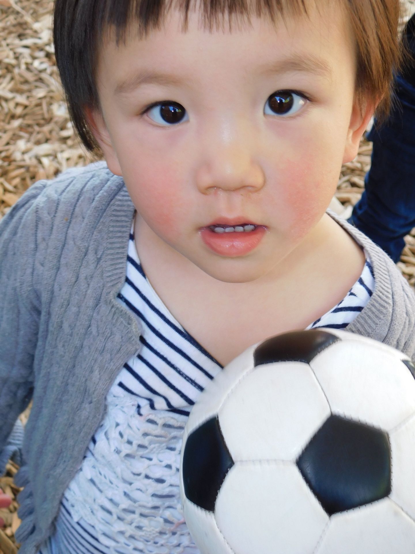 Young child with rosy cheeks