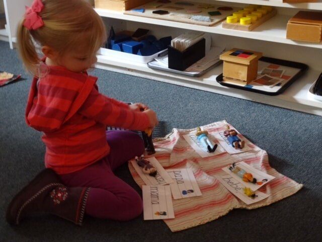 Young girl in red shirt and purple pants 