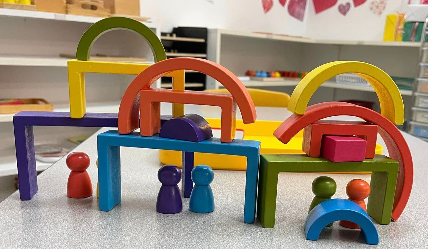Colorful wooden blocks and figures arranged on a table