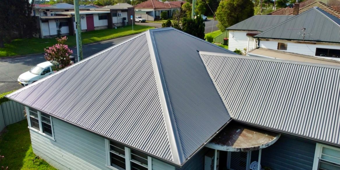 Metal Standing Seam Roof On A Residential Home — Your Craftsmen in Eleebana, NSW