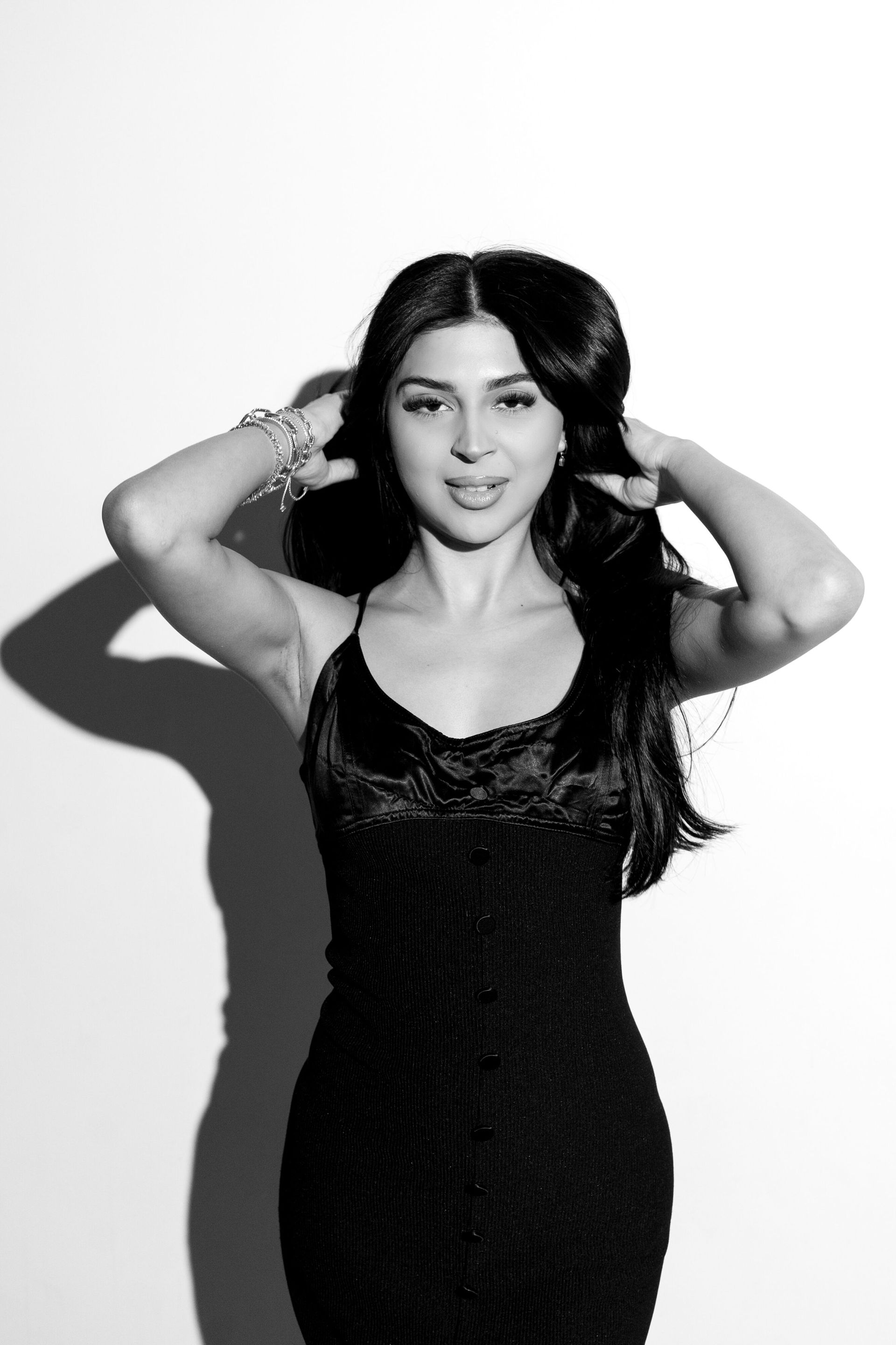 Glam Photo Booth fun: person dressed up in black modeling for a glam styled shoot.