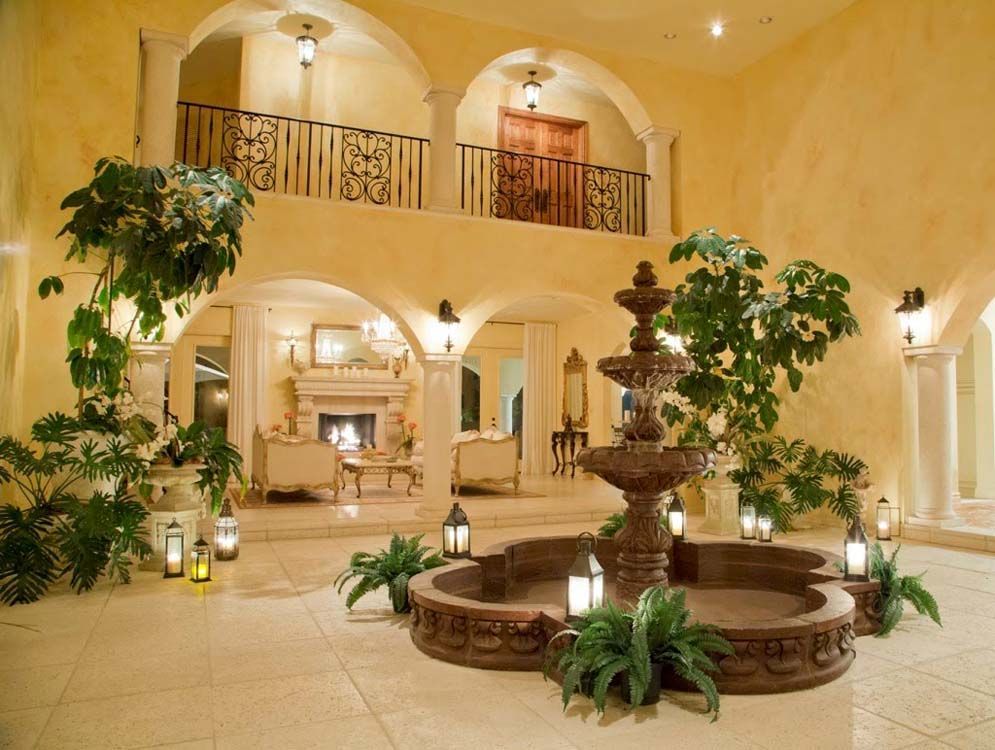 A large room with a fountain in the middle of it