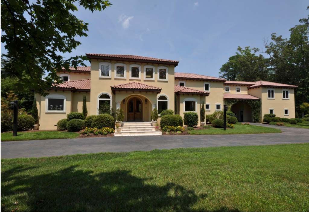 A large house with a driveway leading to it