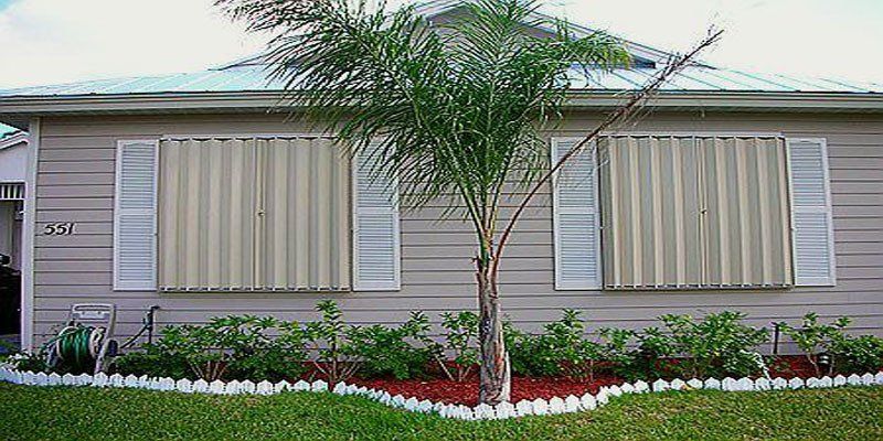 Residential home's window hurricane shutters