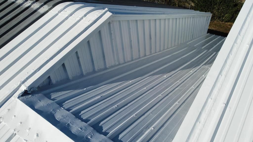 A white roof with a hole in the middle of it.