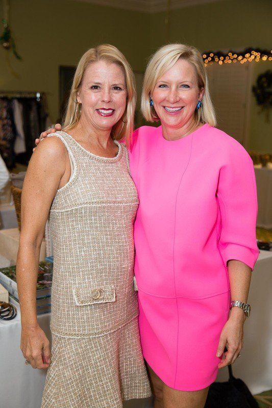 two women smiling and posing for picture