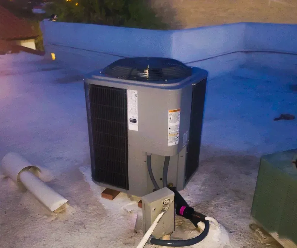 An air conditioner is sitting on the roof of a building
