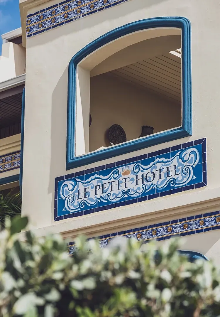 Cream building with blue tiled 