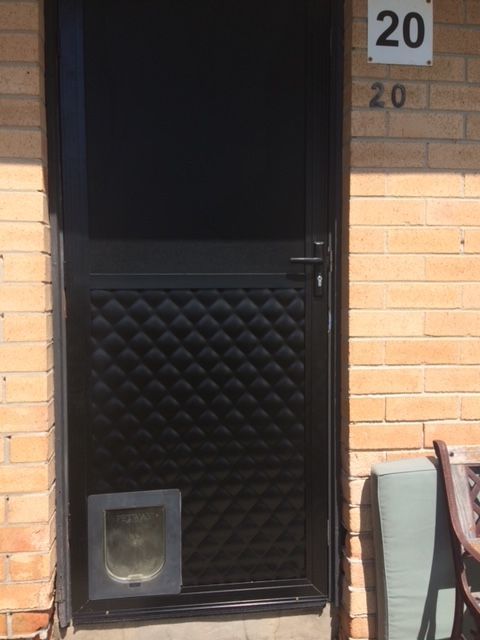 House Door with Pet Door — Windows & Doors in Wollongong