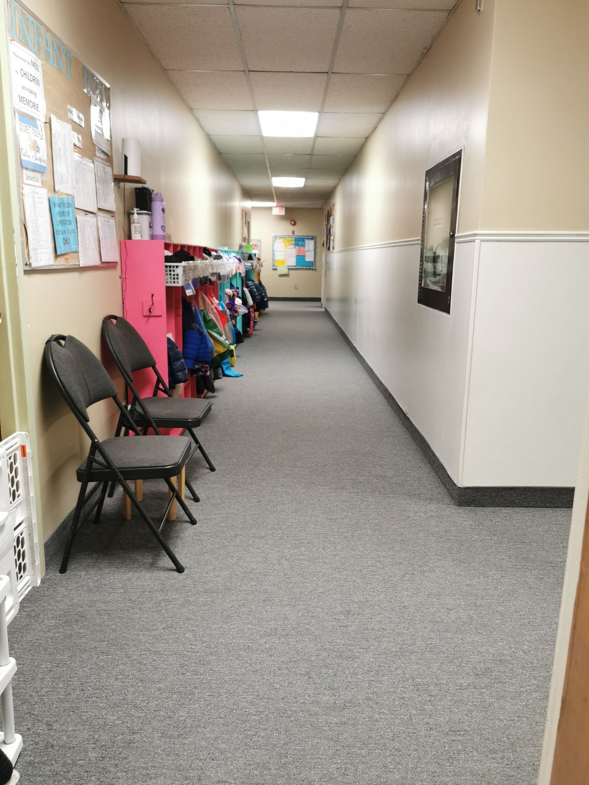 daycare room with book shelf and long rectangular table