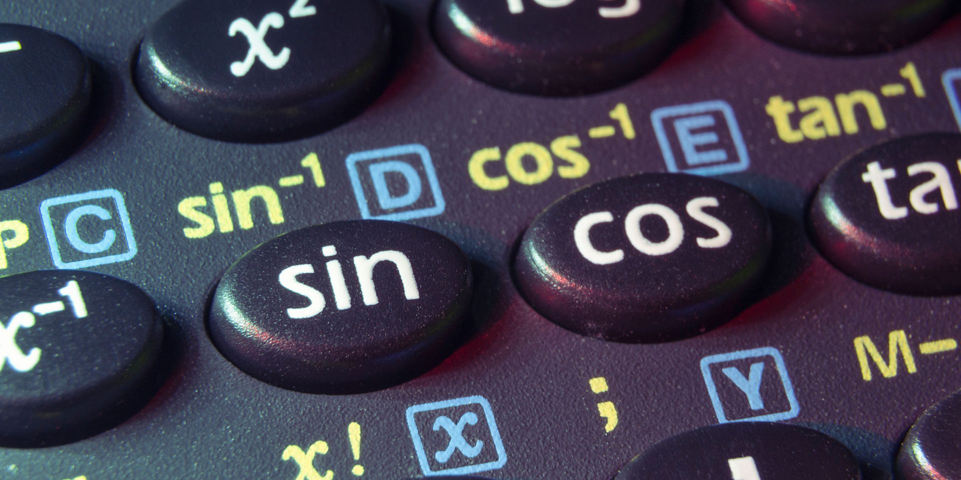 A close up of a calculator with buttons for sin cos and tan