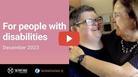 a woman is hugging a woman with disabilities in a video .