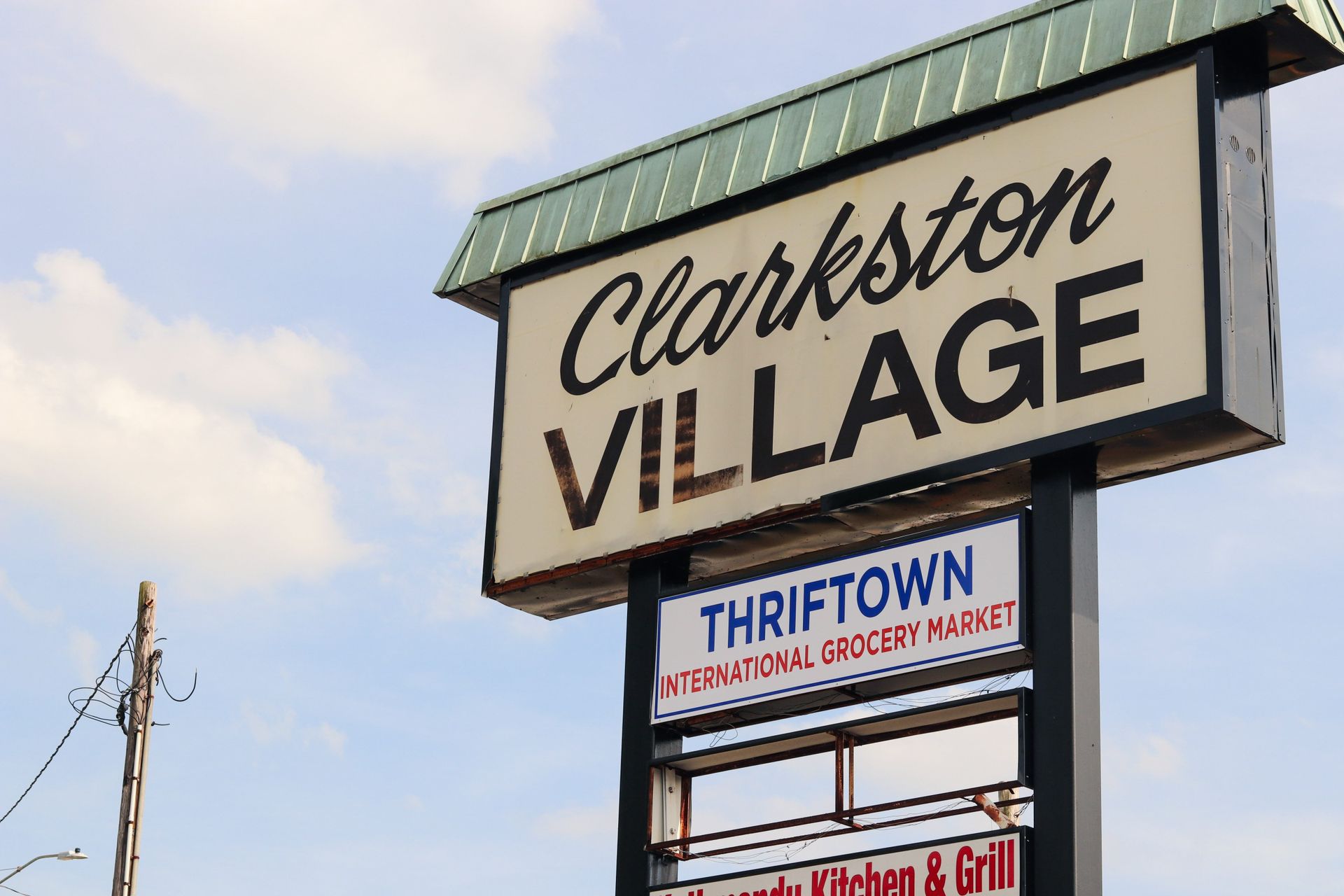 Schoolchildren on a packed bus, wearing uniforms. Interior view with a woman in a blue headscarf.