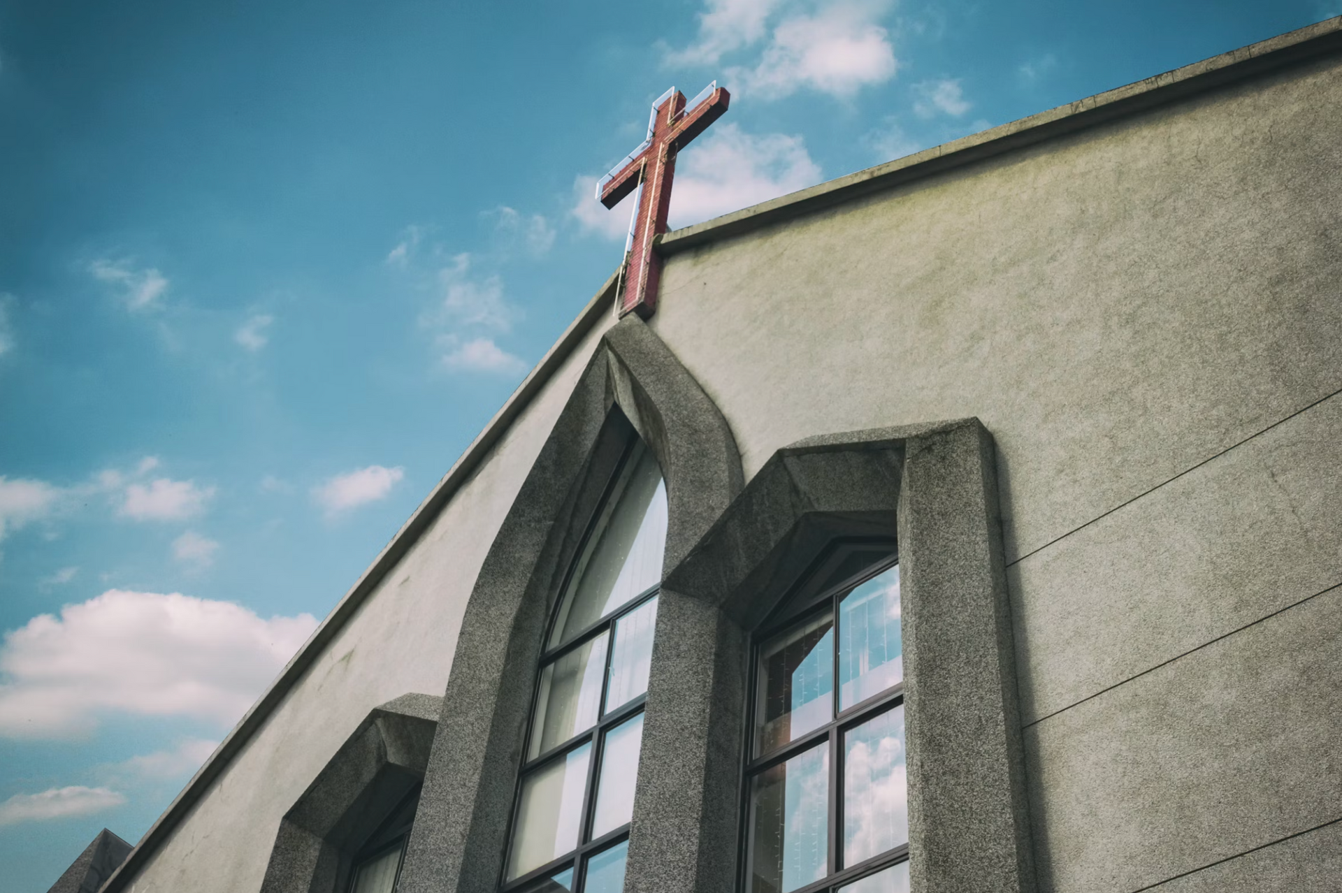 A church with a cross on top of it.