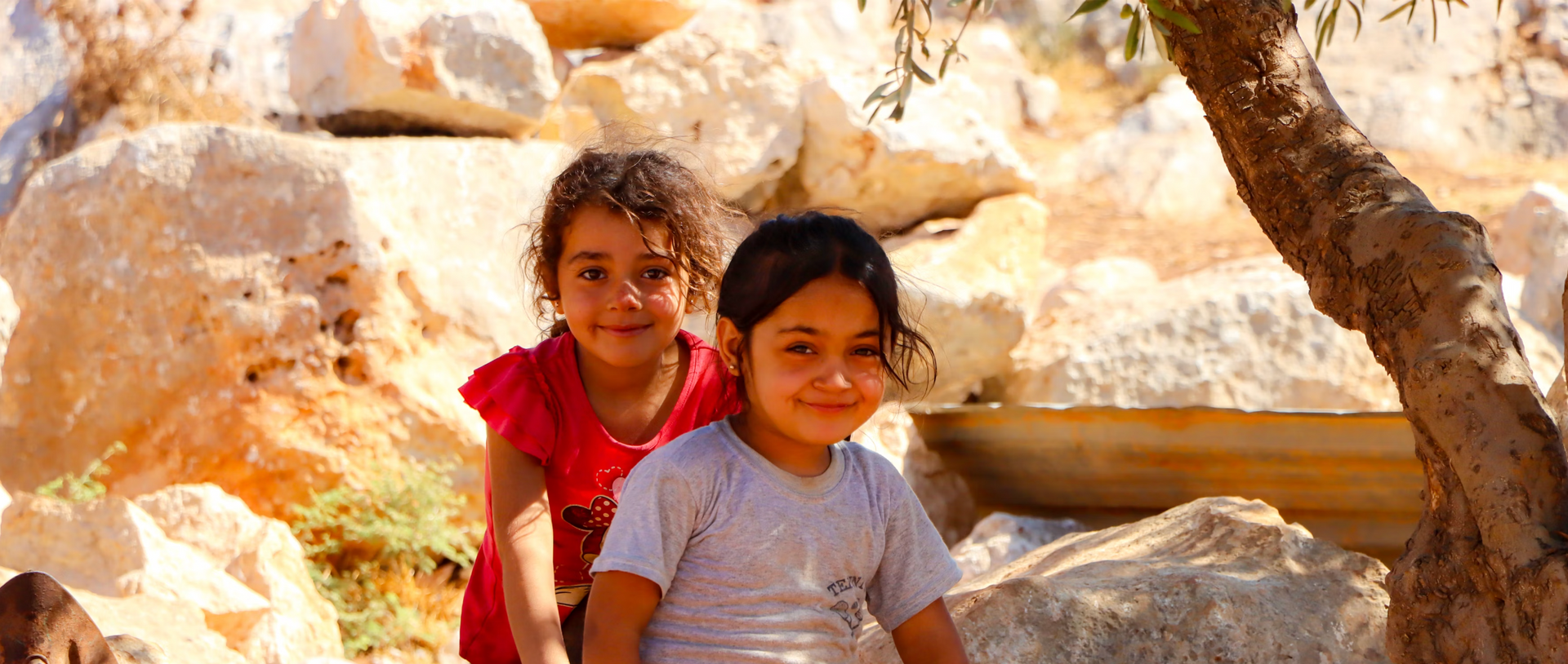 two refugee girls playing