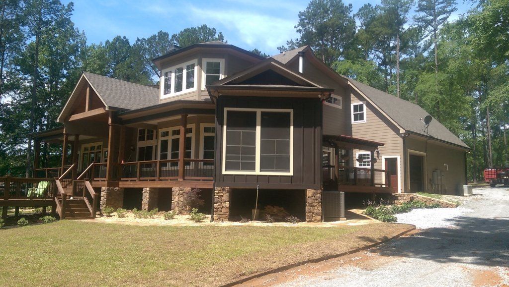 Lincolnton lakehouse with dark bronze accent gutters