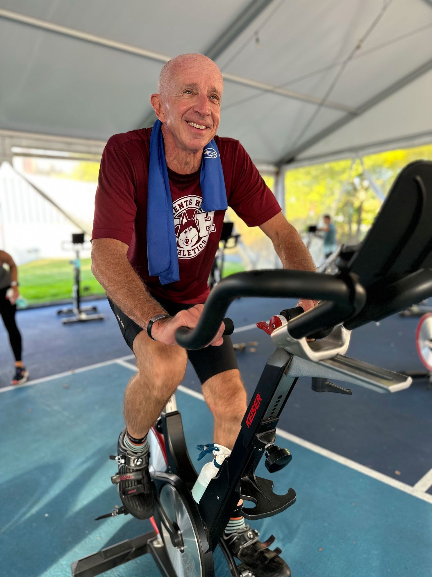 Member riding on a spin bike during our cycling class in Barrington.