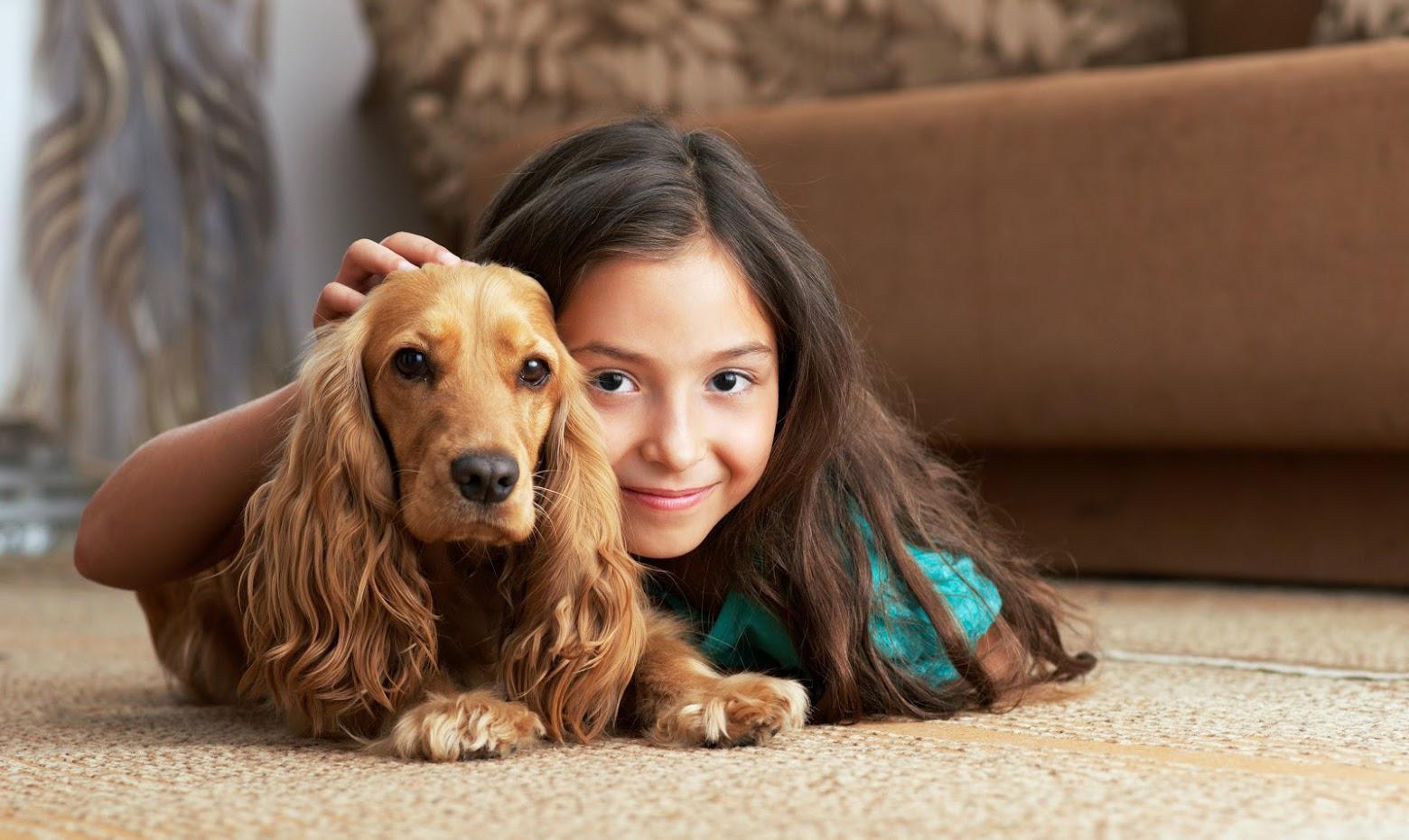 Professional Carpet Cleaners — Girl and Dog on a Carpet in Fishers, IN