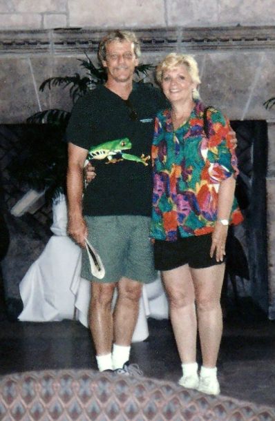 Image of Jim and Annie in front of fireplace