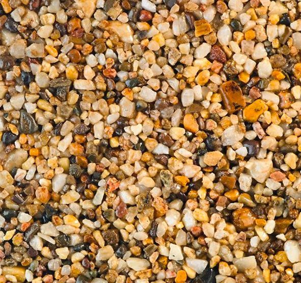 a pile of small rocks of different colors and sizes