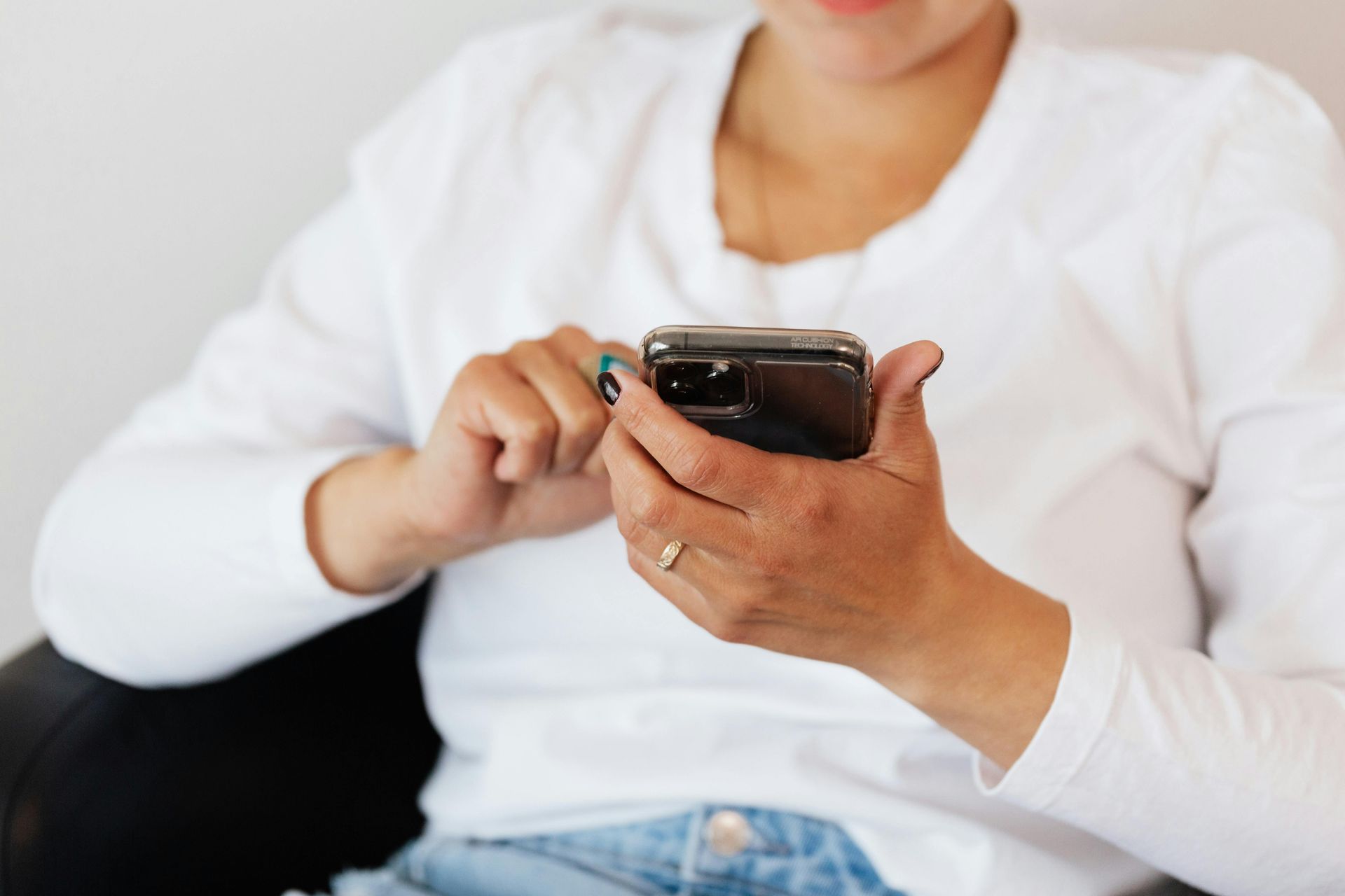 person typing on cell phone
