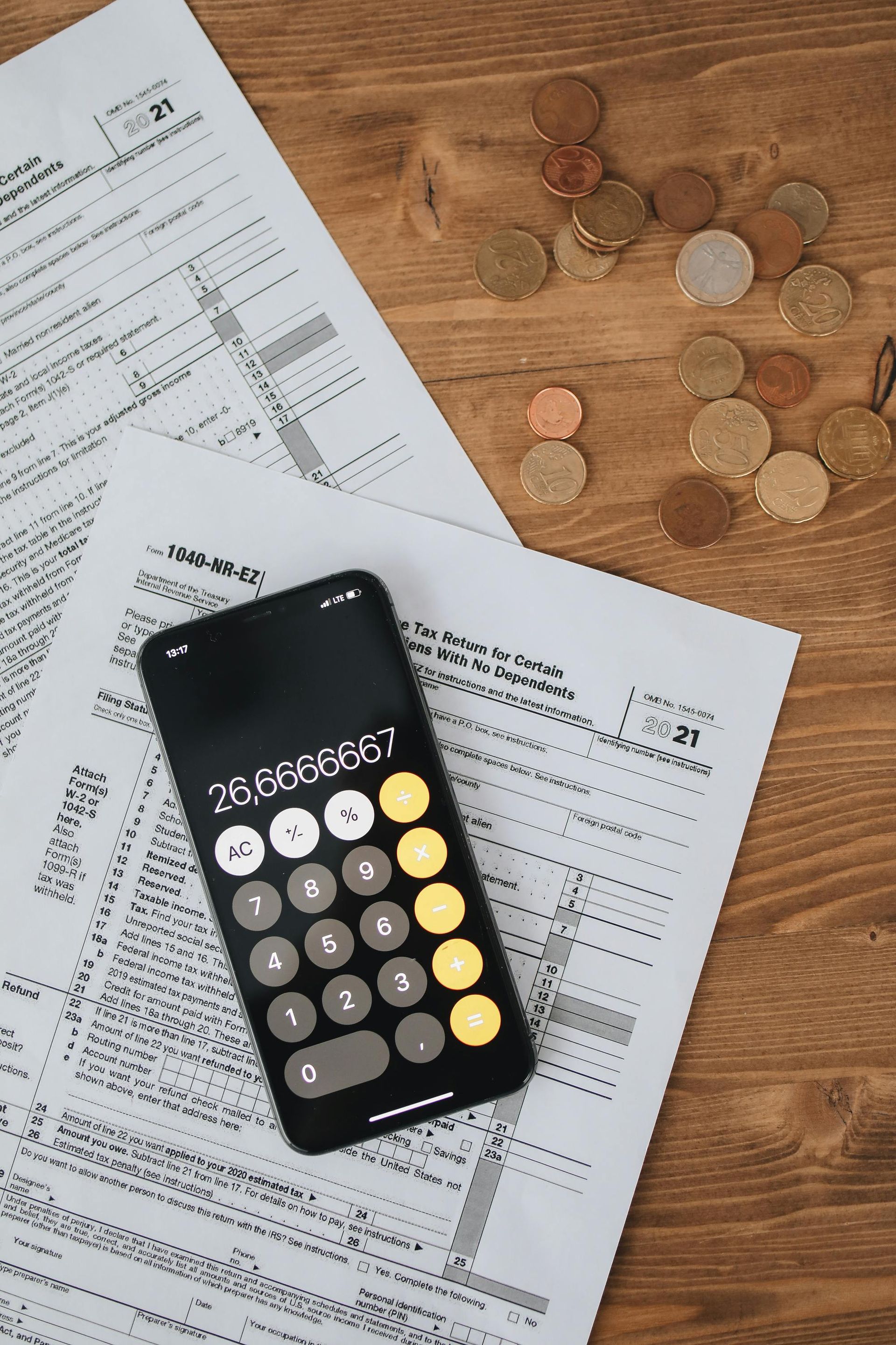 Calculator laying on tax forms