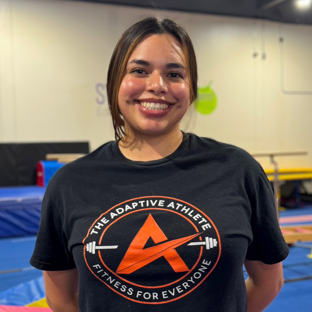A gymnastics coach at the adaptive athlete.