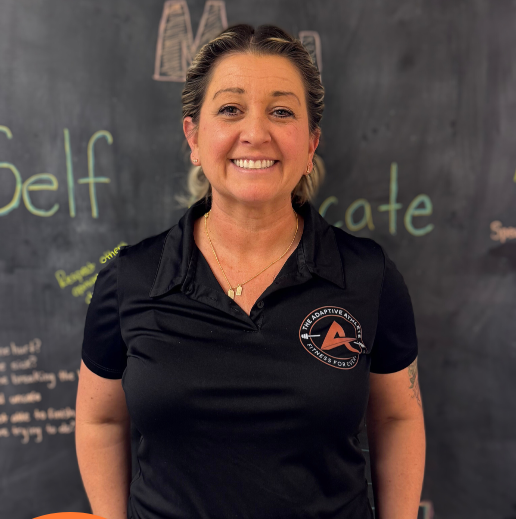 A gymnastics coach at the adaptive athlete.
