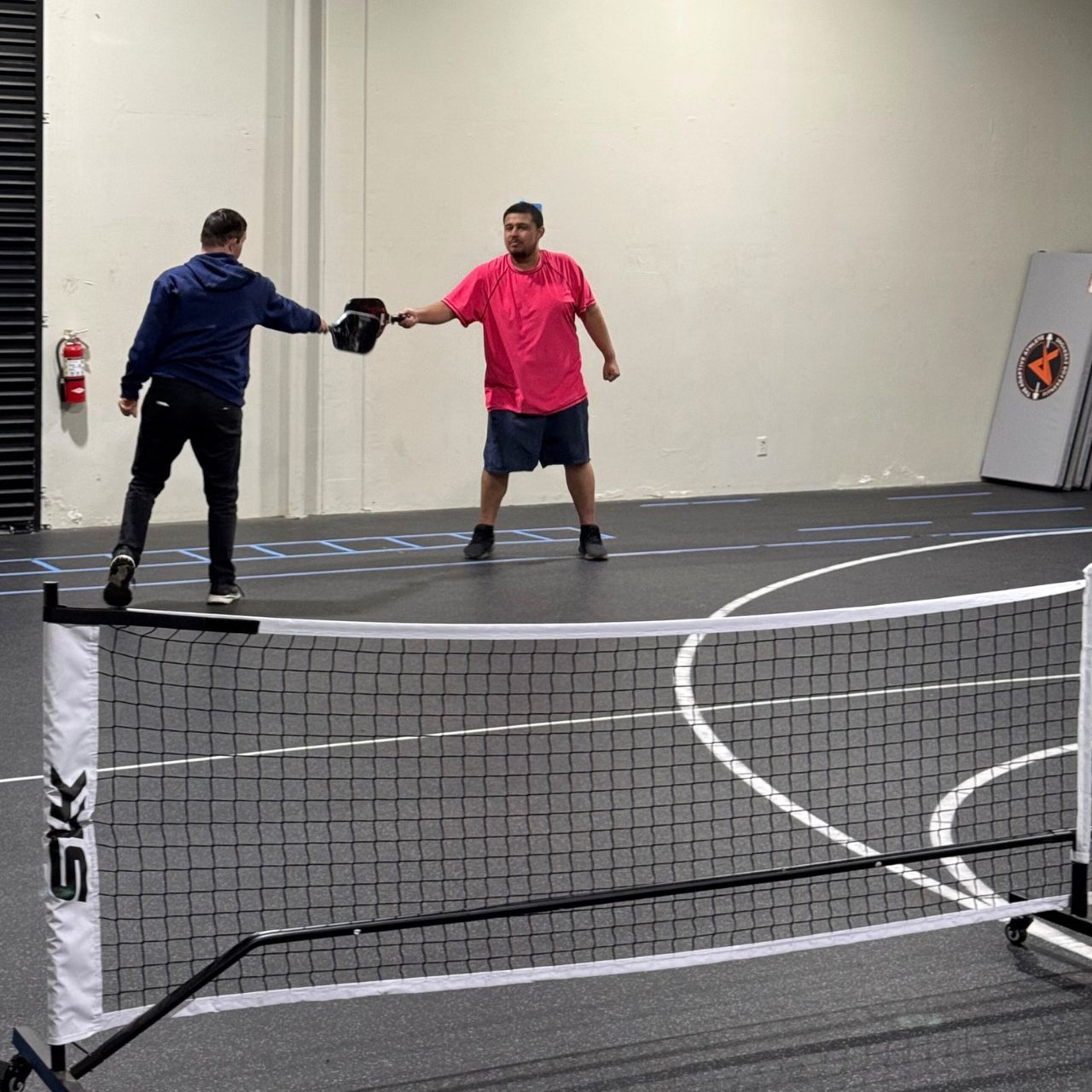 Two boys enjoying a casual pickleball match at the adaptive athlete in upland California.