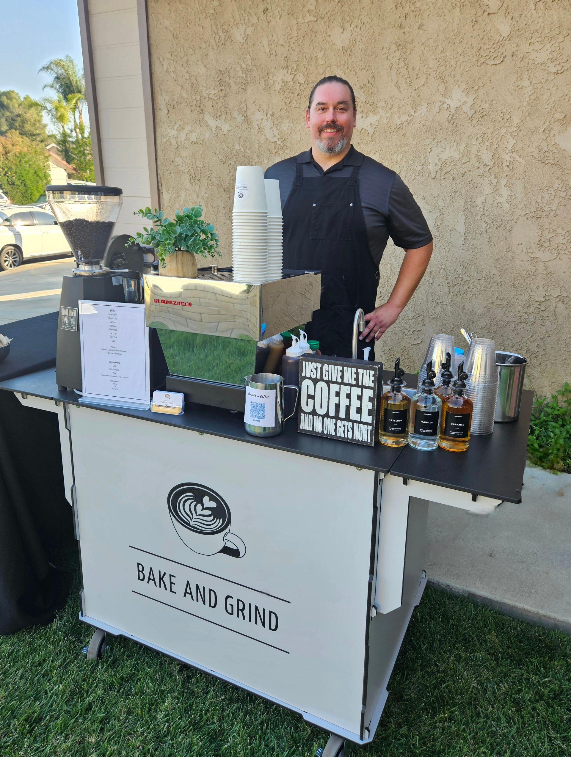Tony standing behind coffee cart set up