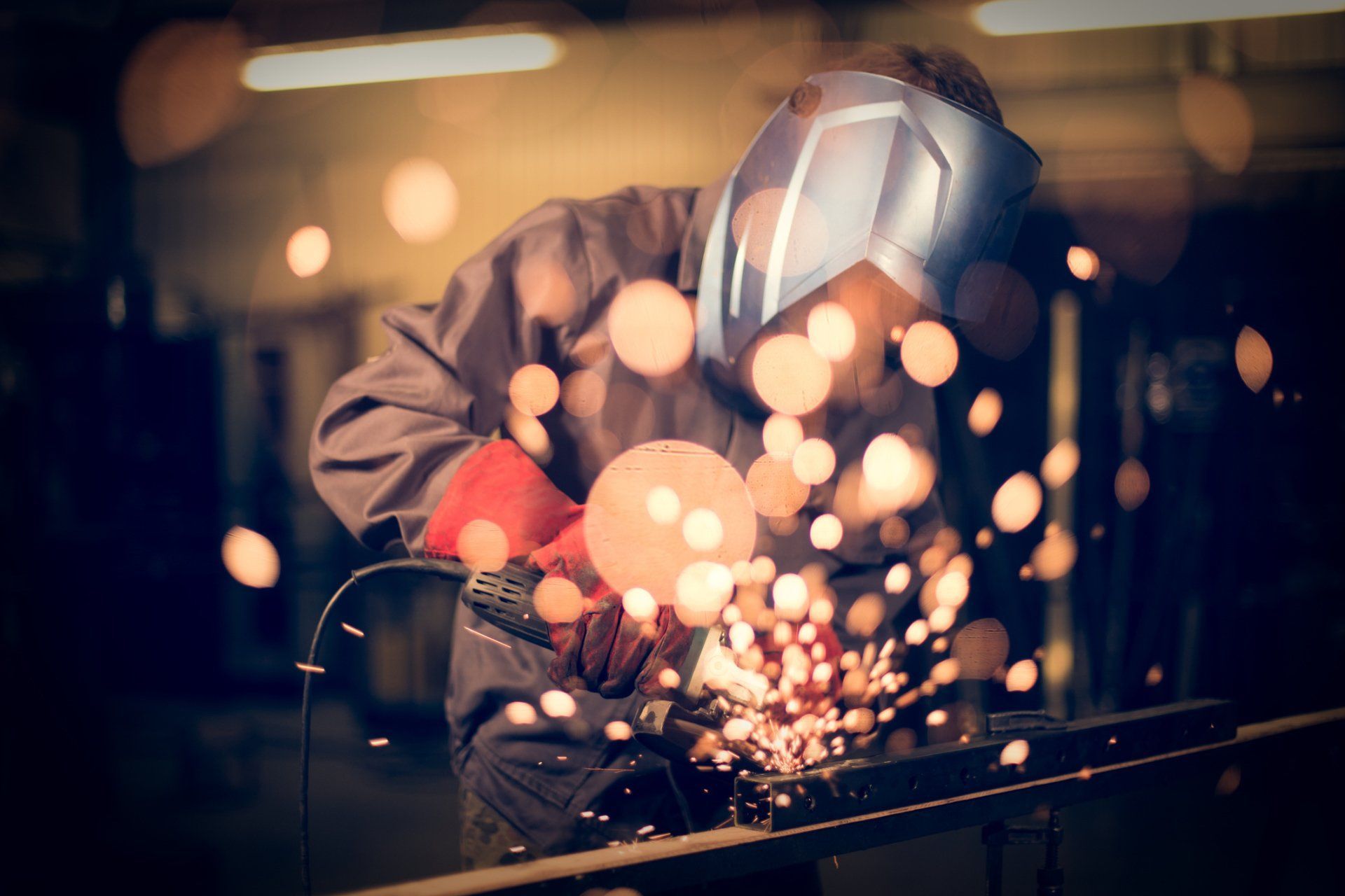 Worker Using Metal Grinder — San Diego, CA — Sam's Welding, Inc.
