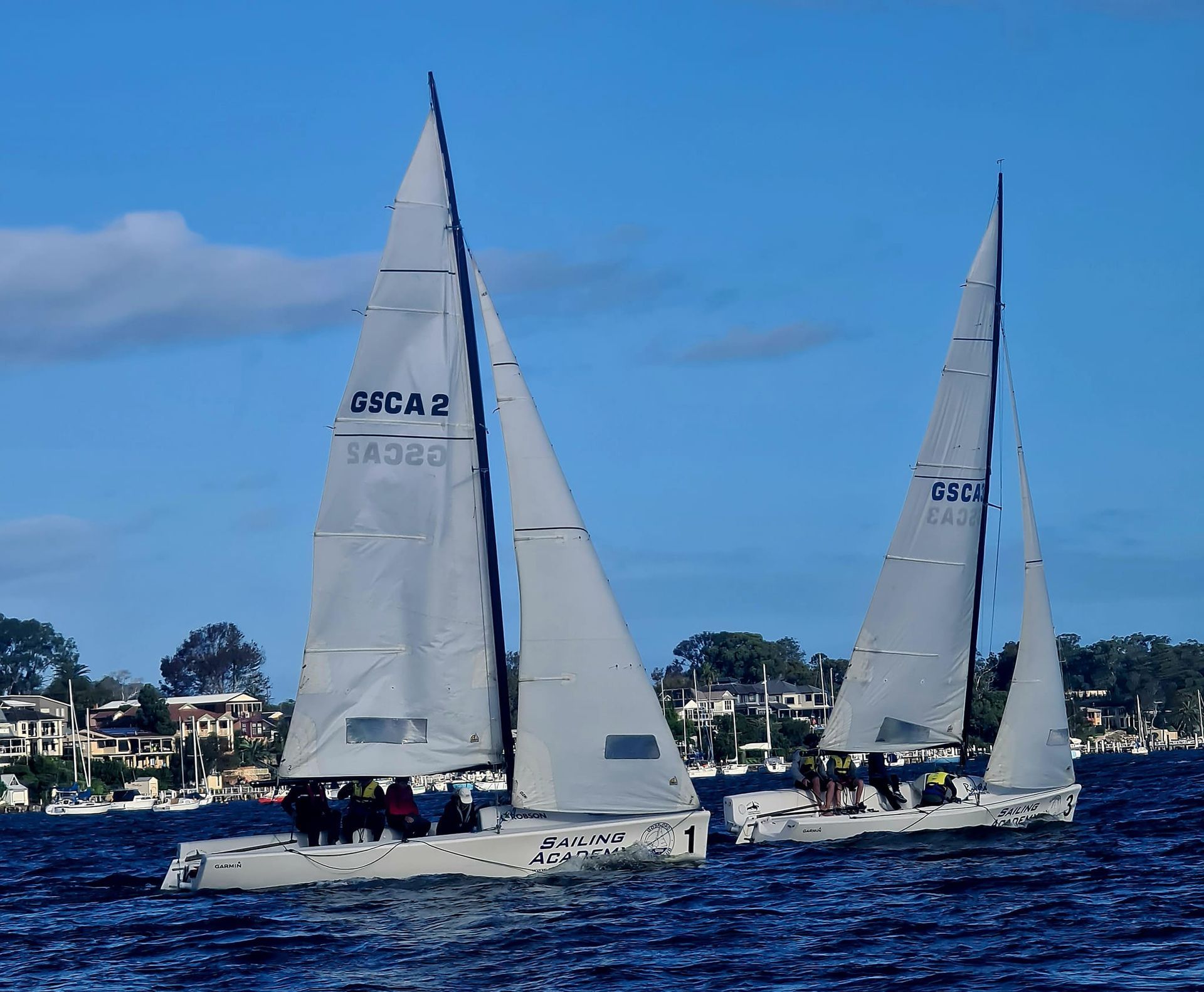 Two Sailboats Racing on a Blue Sea — Gosford Sailing Club in Gosford, NSW