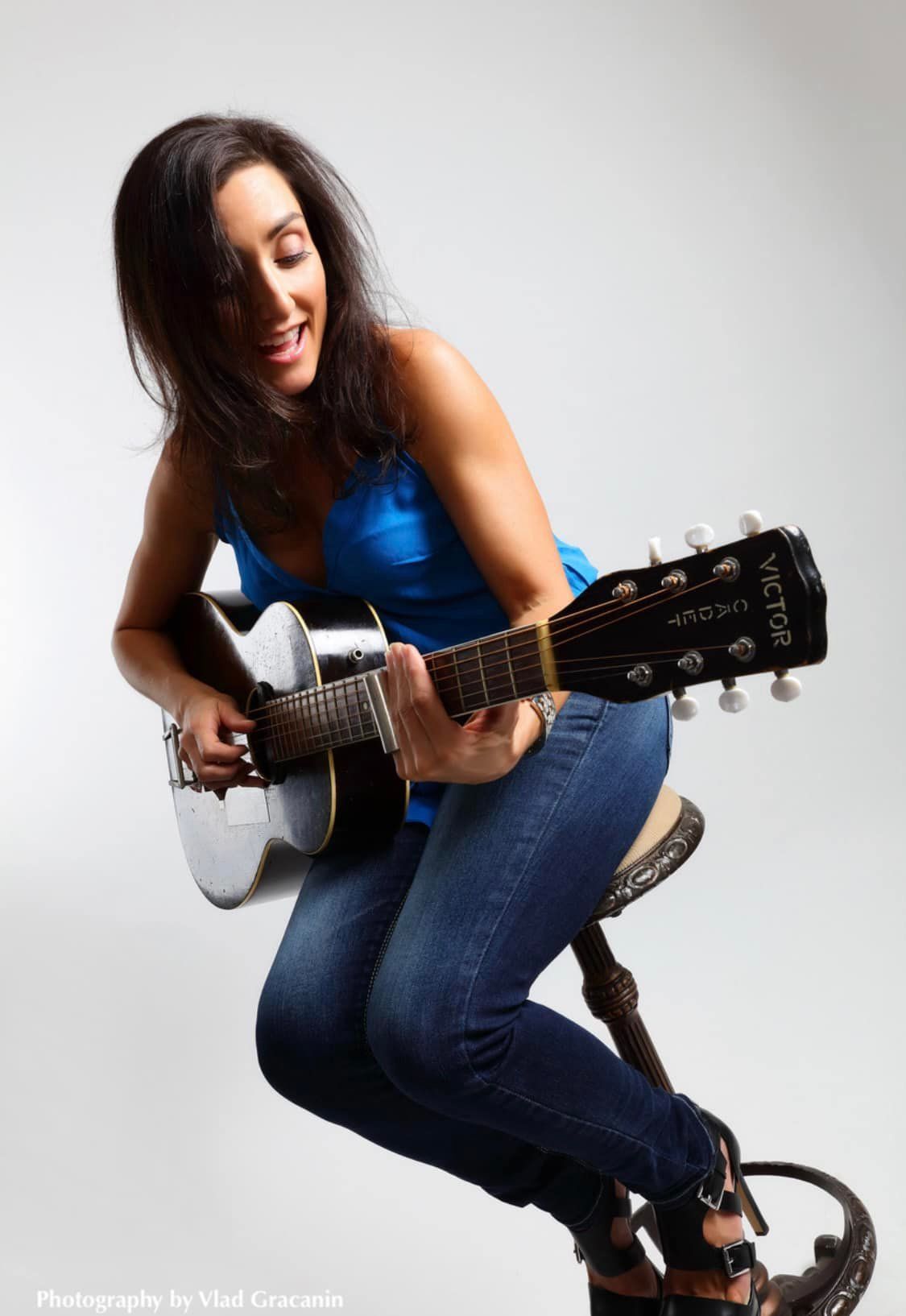Woman Playing Acoustic Guitar — Gosford Sailing Club in Gosford, NSW