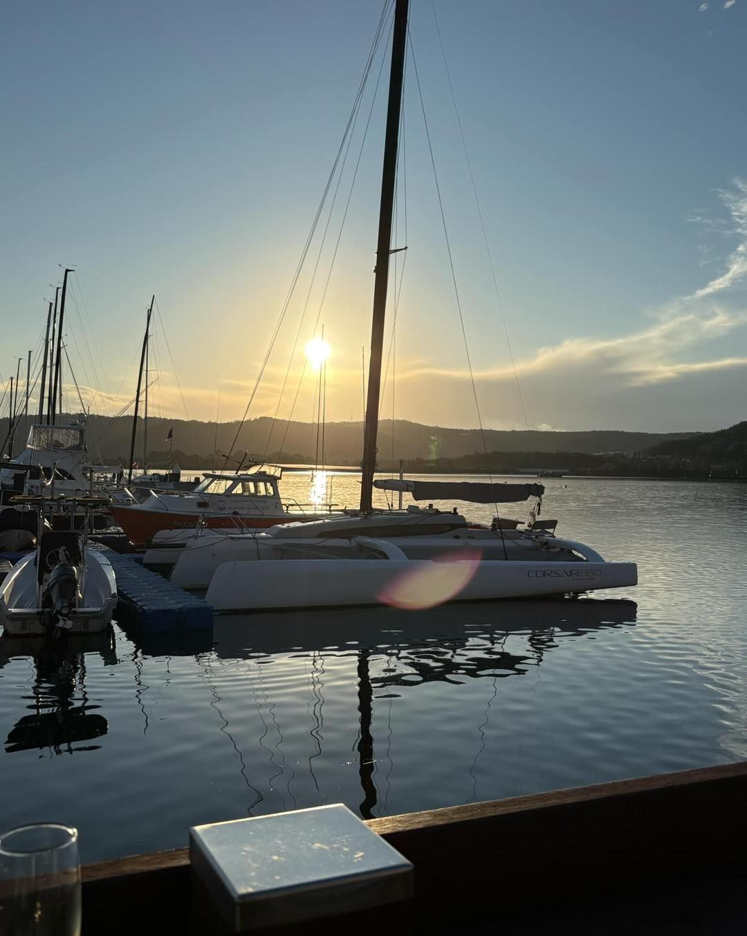 Sailboats at a Harbor With the Sun — Gosford Sailing Club in Gosford, NSW