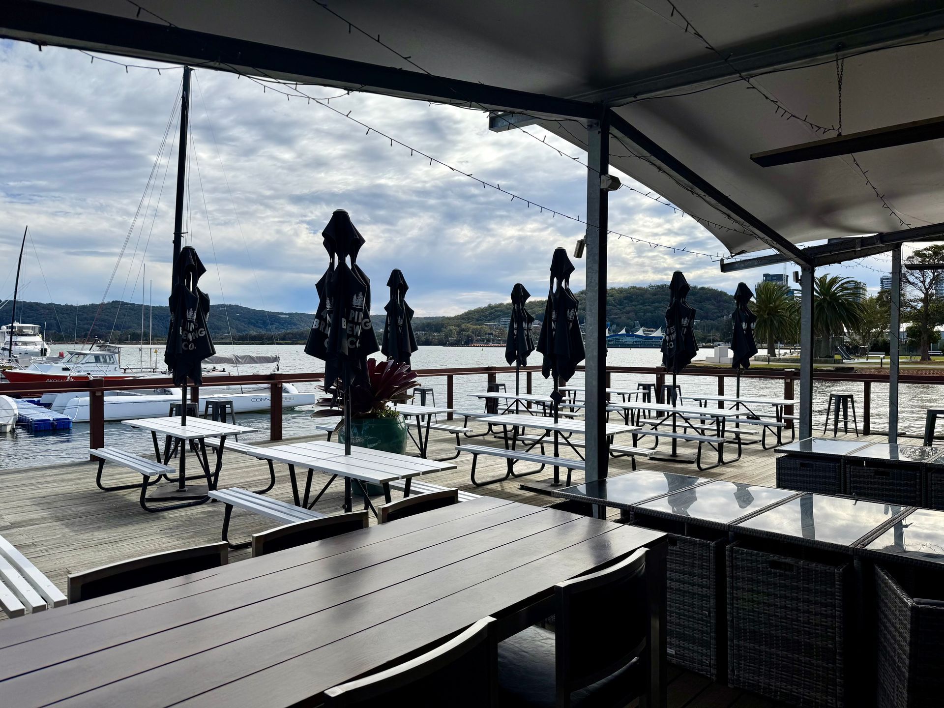 A Group of People Are Sitting on a Sailboat in the Water — Gosford Sailing Club in Gosford, NSW