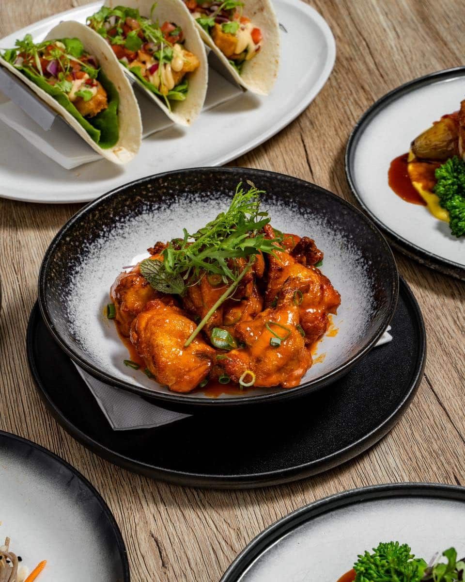 A Table Topped With Plates of Food and a Bowl of Food — Gosford Sailing Club in Gosford, NSW