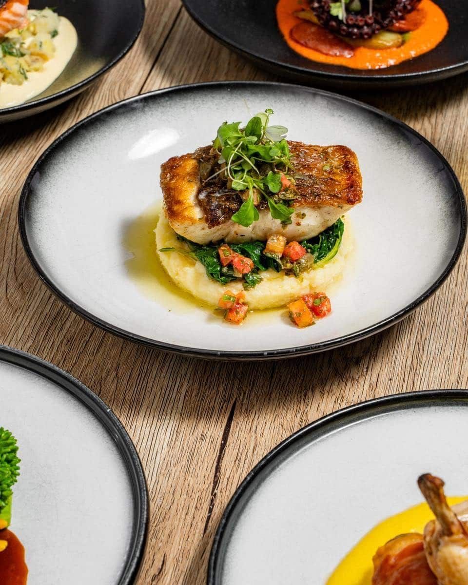 A Variety of Plates of Food Are Sitting on a Wooden Table — Gosford Sailing Club in Gosford, NSW