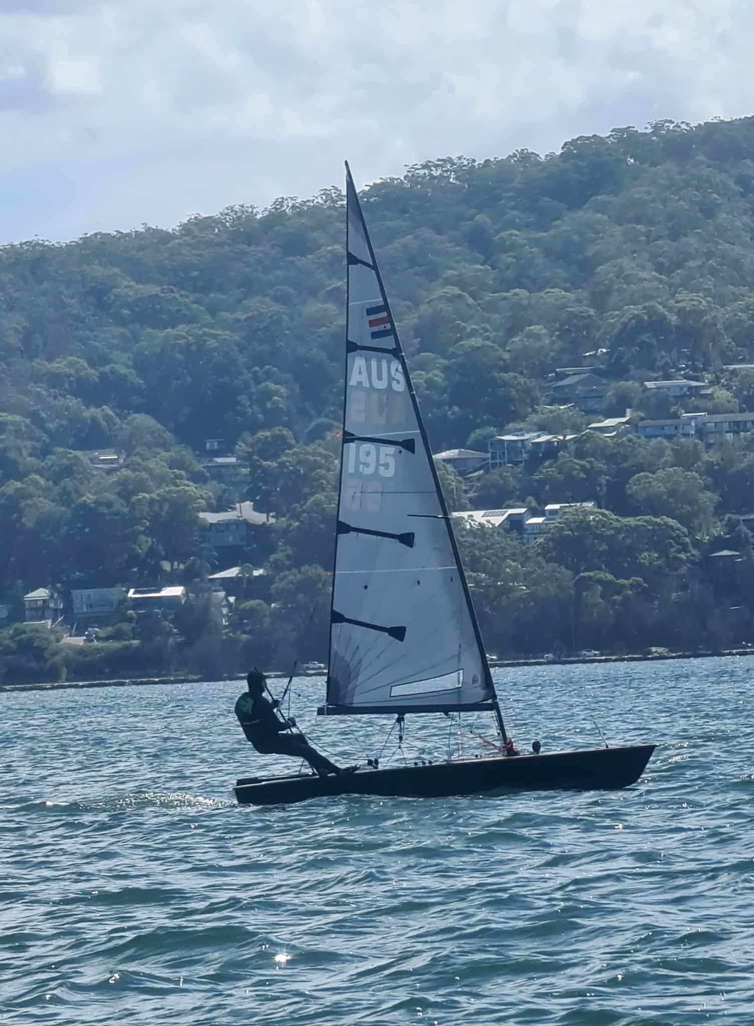 A Small Sailboat is Floating on Top of a Body of Water — Gosford Sailing Club in Gosford, NSW