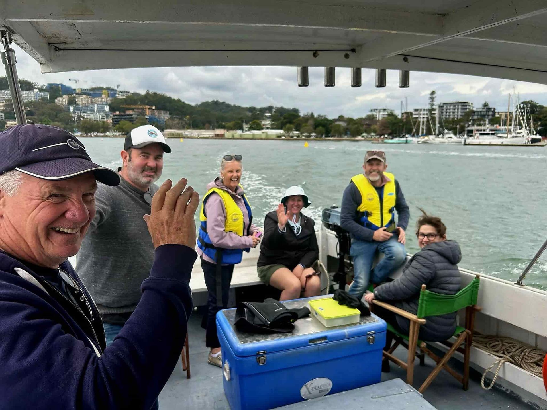 A Group of People Are Sitting on a Boat in the Water — Gosford Sailing Club in Gosford, NSW