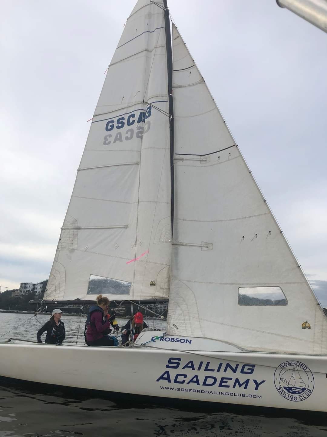 A Sailboat With the Word Sailing Academy on It — Gosford Sailing Club in Gosford, NSW