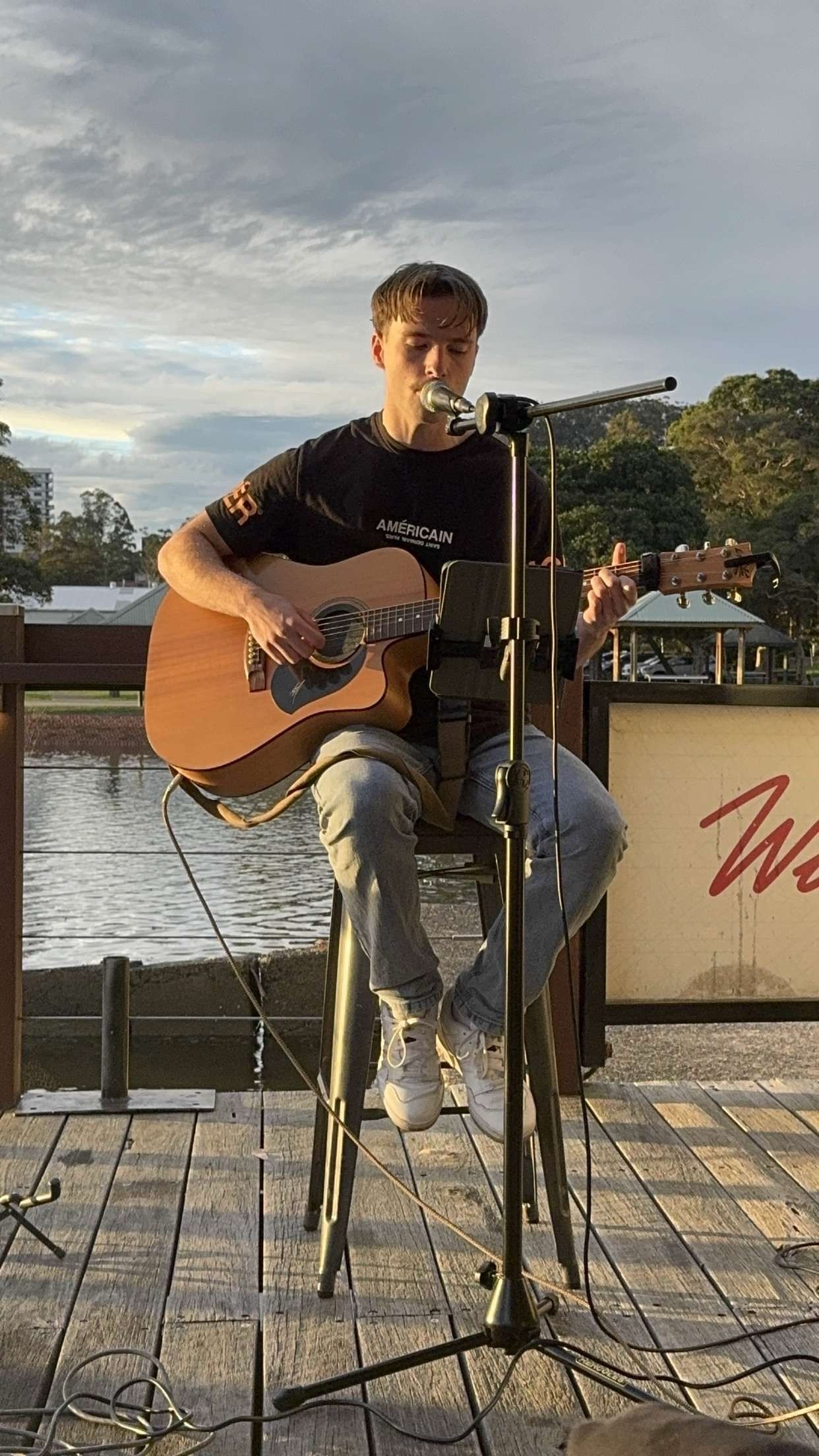 Woman Playing Guitar on Stage — Gosford Sailing Club in Gosford, NSW