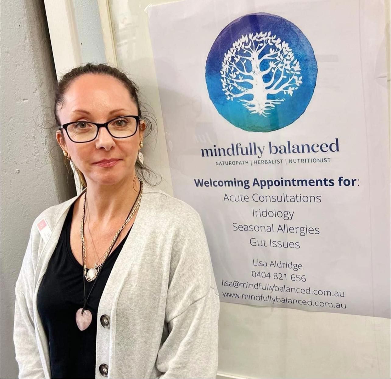 Health Product Enquiries | Owner Standing Behind the Counter of her Store | Toronto, NSW